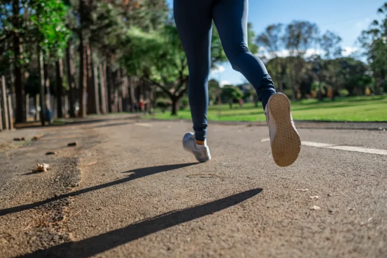 Woman jogging outdoors as part of a regular exercise routine linked to hair and scalp health