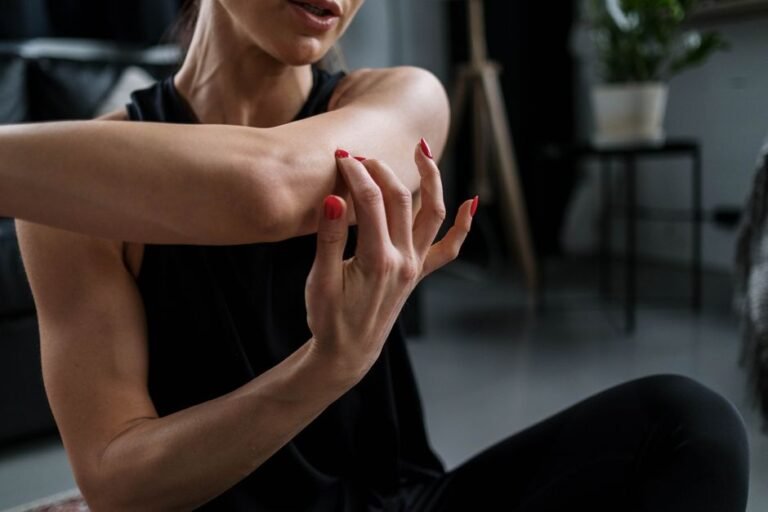 A person gently stretching their legs after a workout